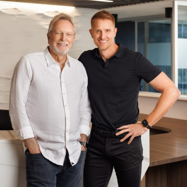 Dr. Myles Honce and Dr. Mark Honce standing in their Kelowna Dental office. 
